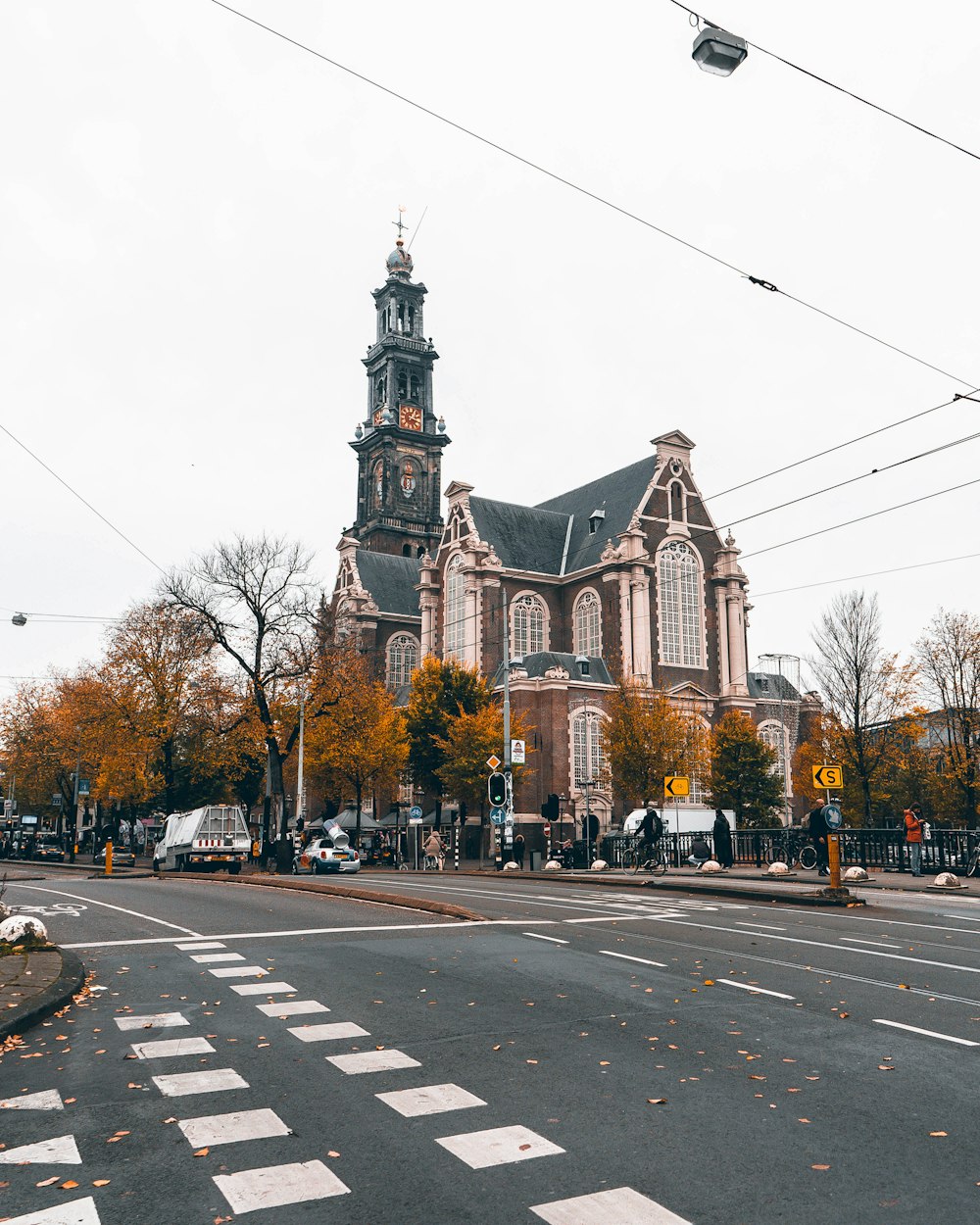 a large church with a steeple and a clock tower