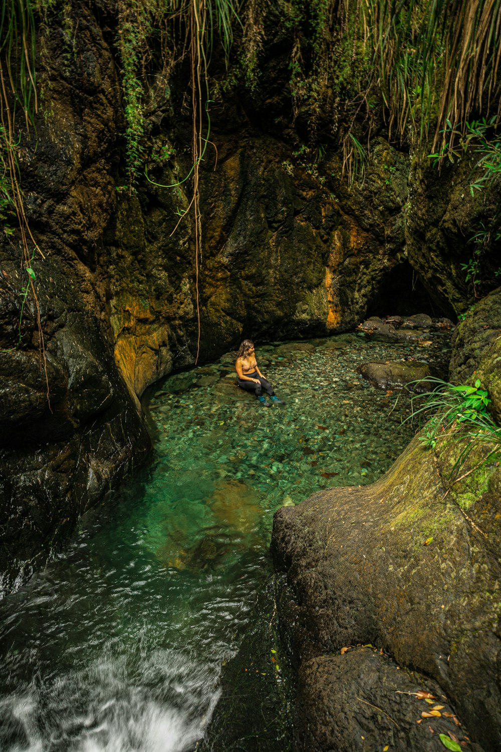 a man in a kayak in the middle of a river