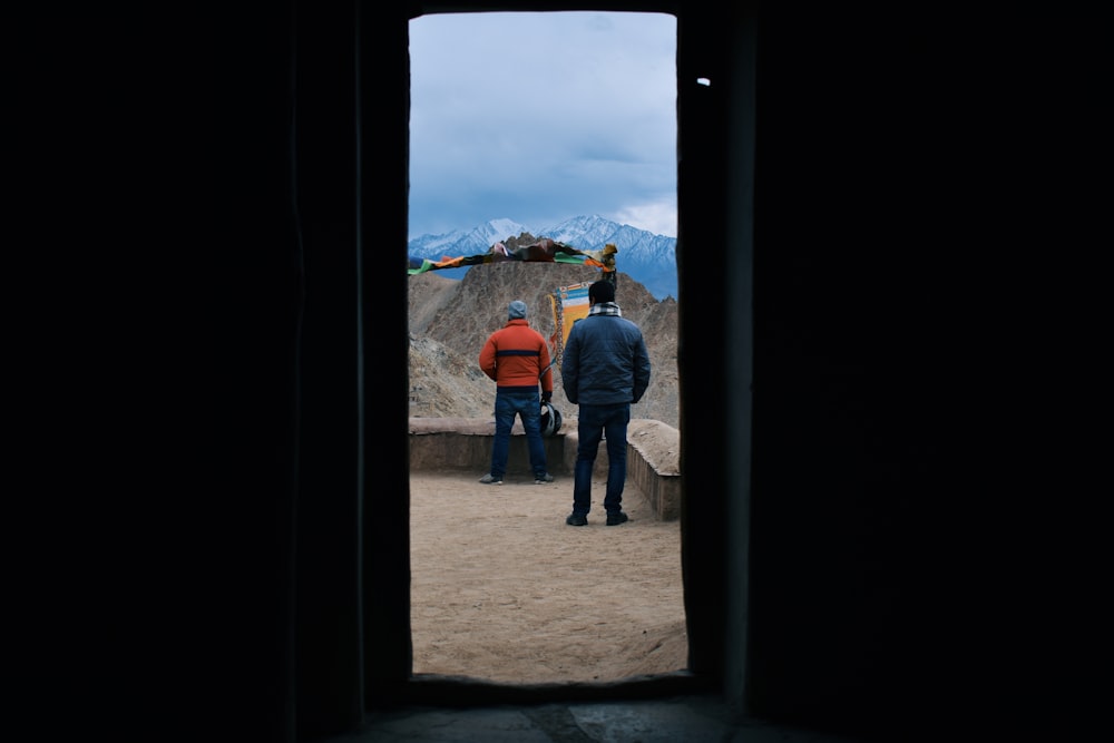 a group of people standing in a doorway