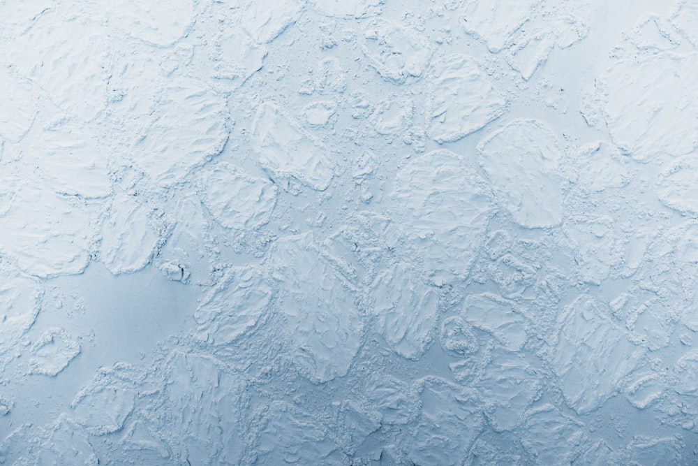 a blue wall with some white paint on it