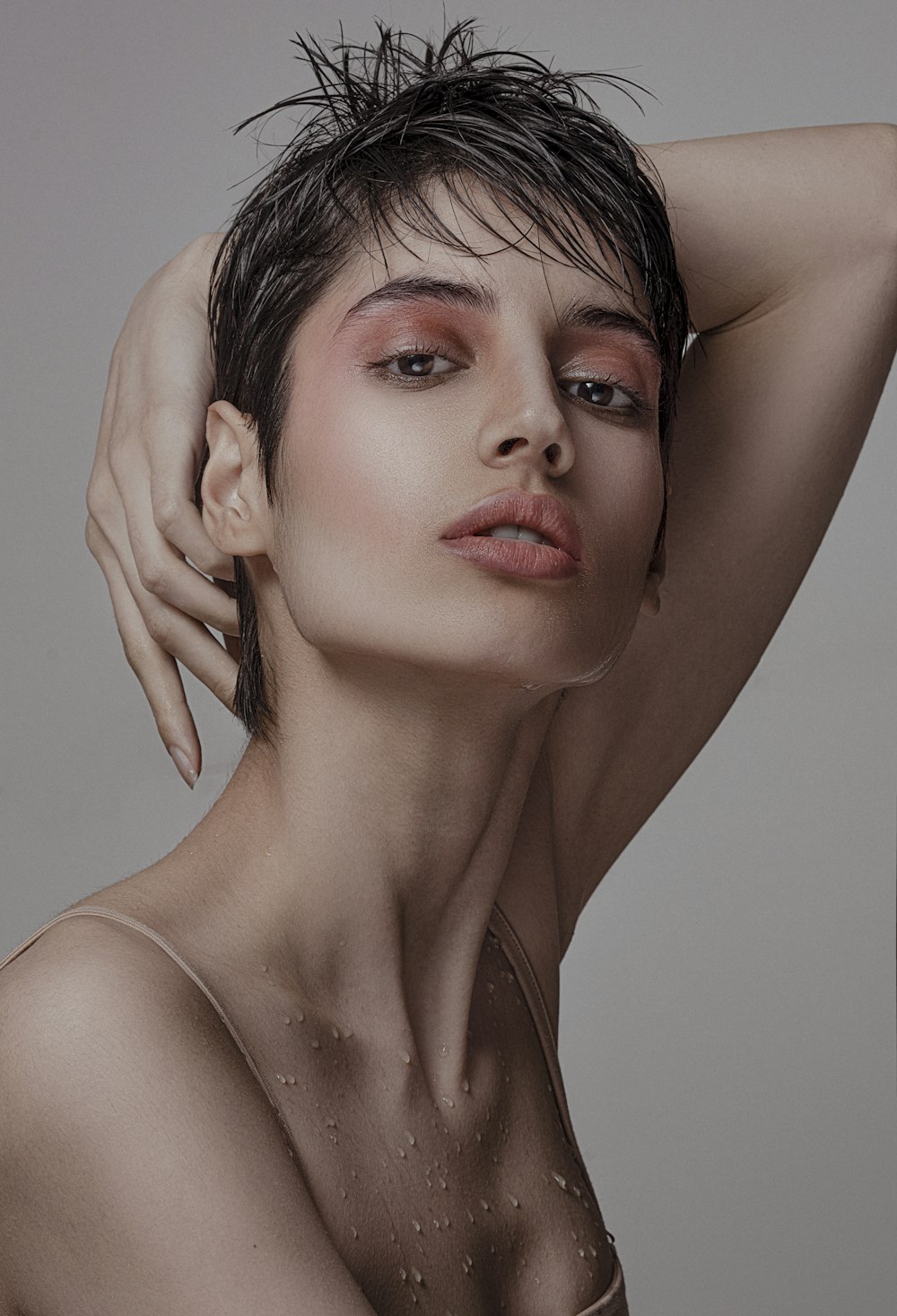 a woman with wet hair posing for a picture