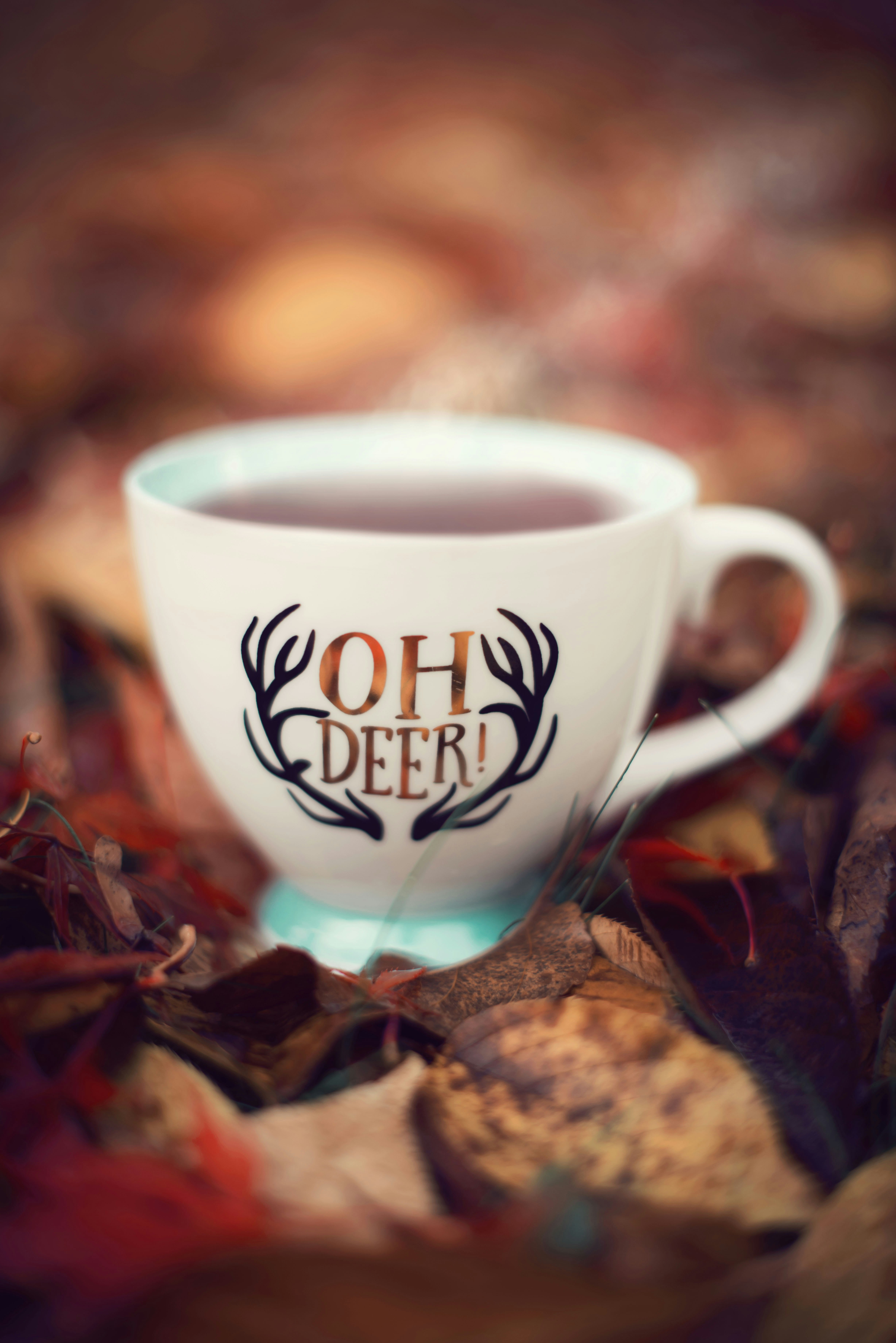 a coffee cup with the words oh deer on it