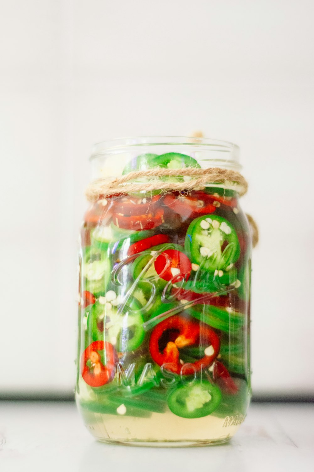 a jar filled with lots of different types of vegetables