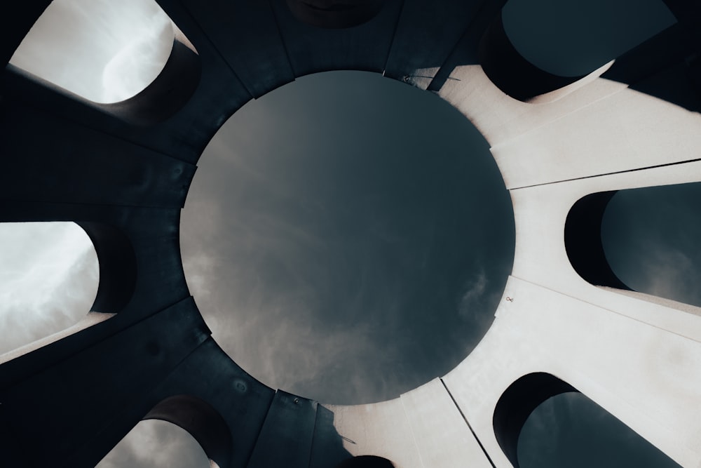 a view of the top of a building with a sky in the background