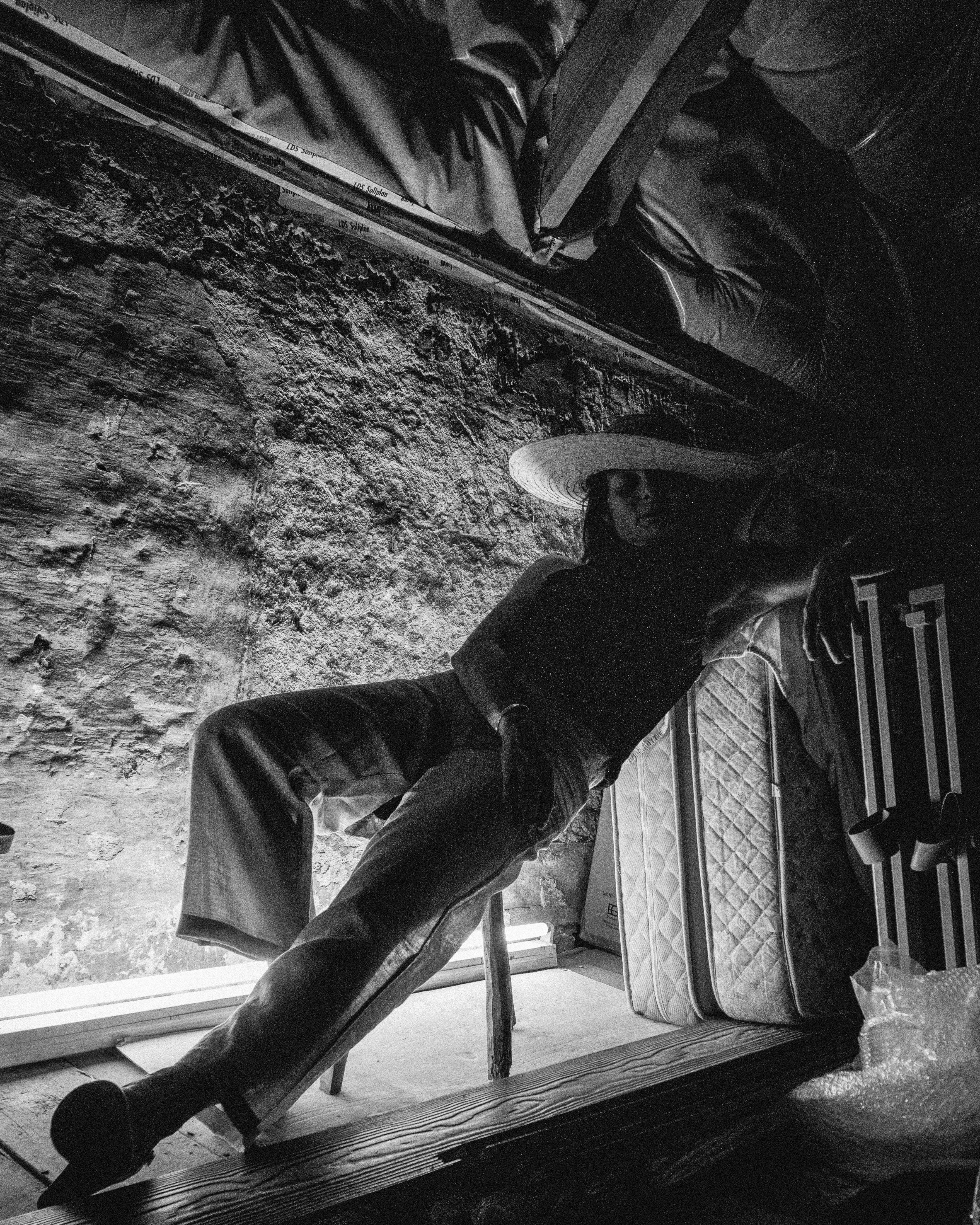 a man sitting on a bench next to a pile of luggage