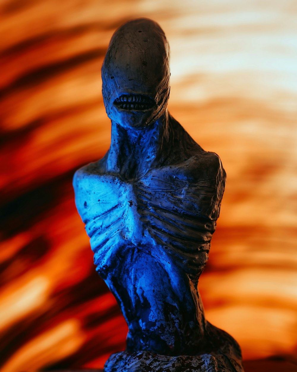 a statue of a person with a blue body