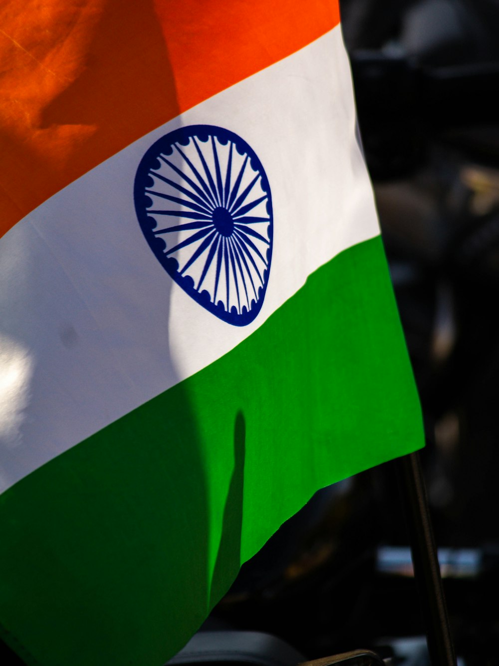 a close up of the indian flag on a motorcycle