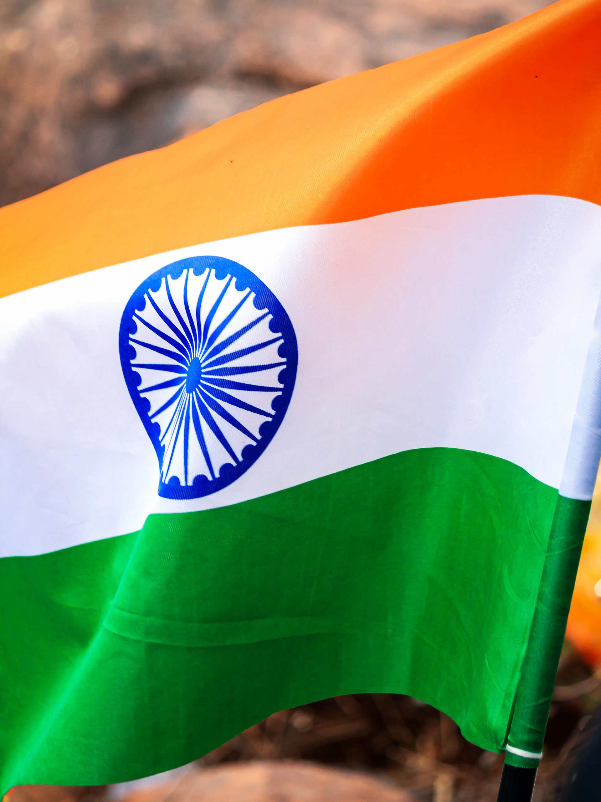 a close up of a flag with a person in the background