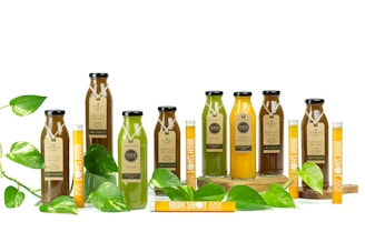 a group of bottles filled with green liquid
