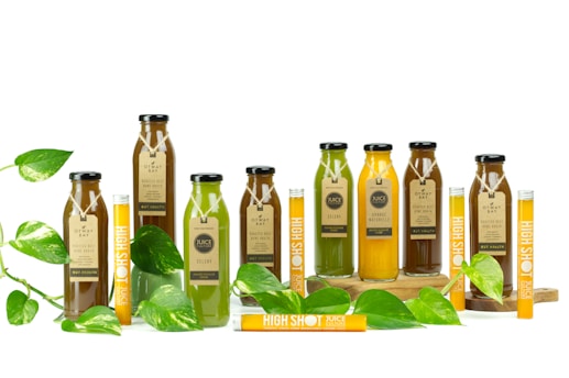 a group of bottles filled with green liquid