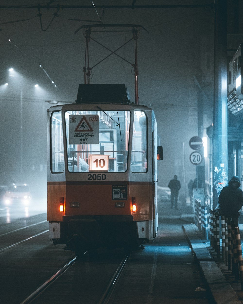 a train on a train track at night