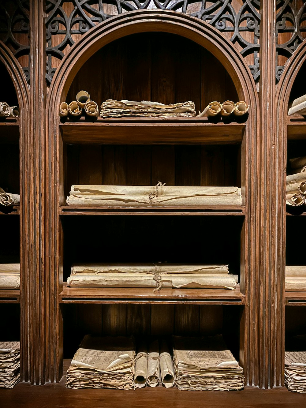 a wooden shelf filled with lots of books