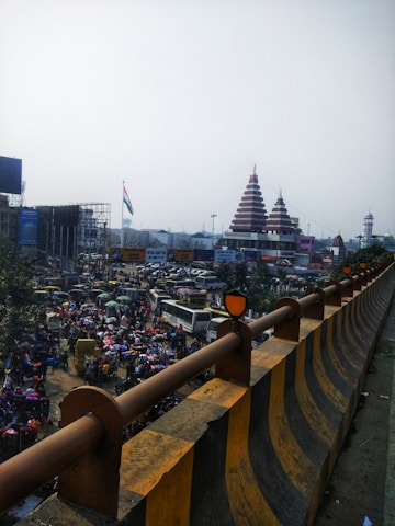 A vibrant street scene in India with various vehicles honking their horns.