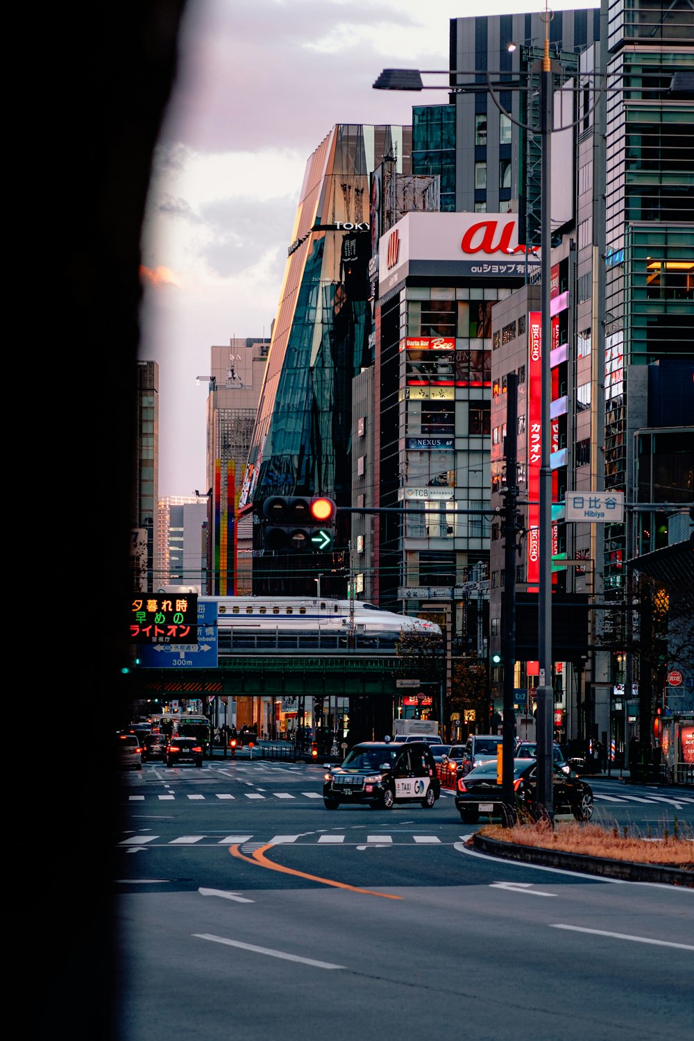 a city street filled with lots of tall buildings