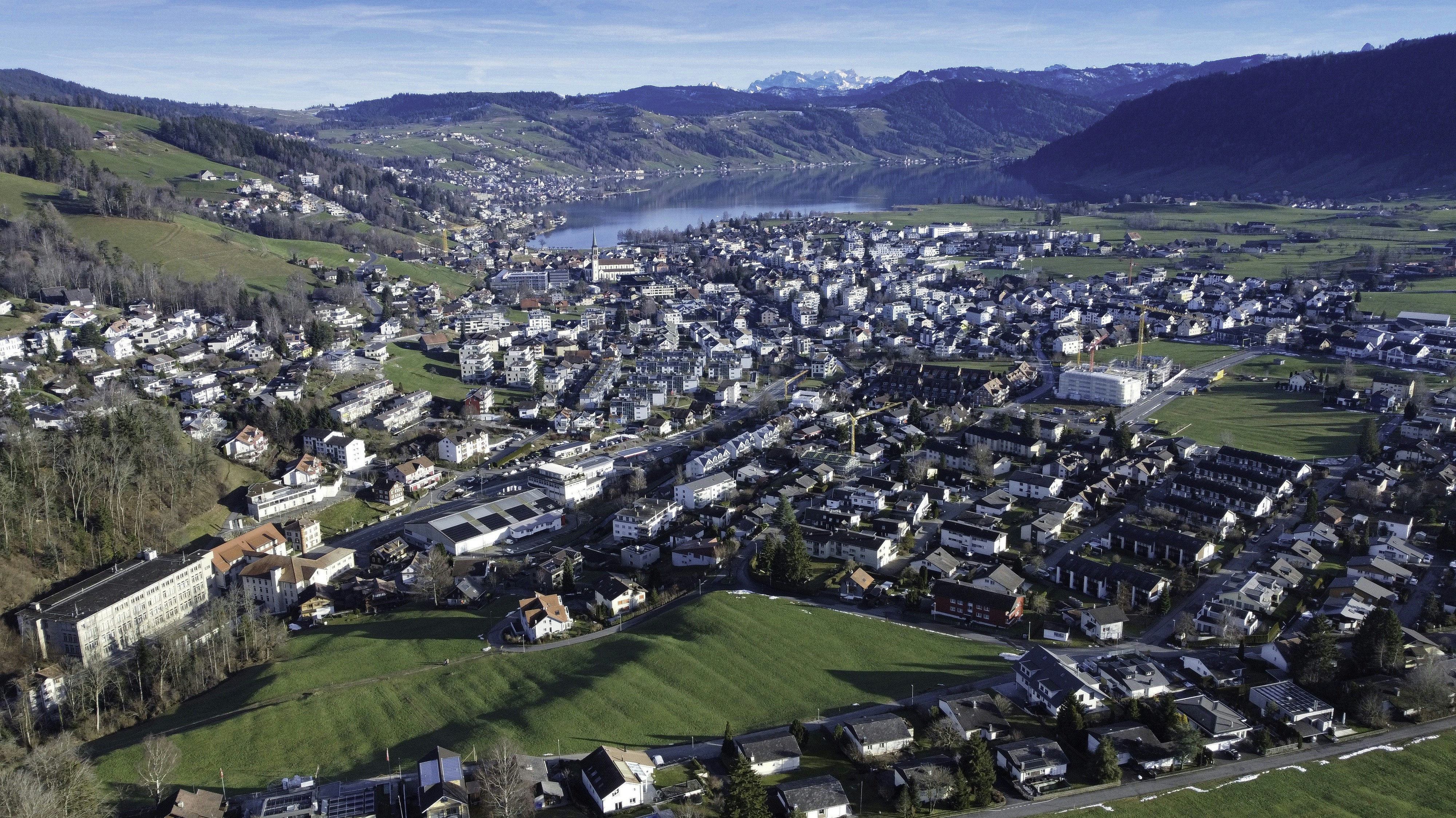 an aerial view of a small town in the mountains