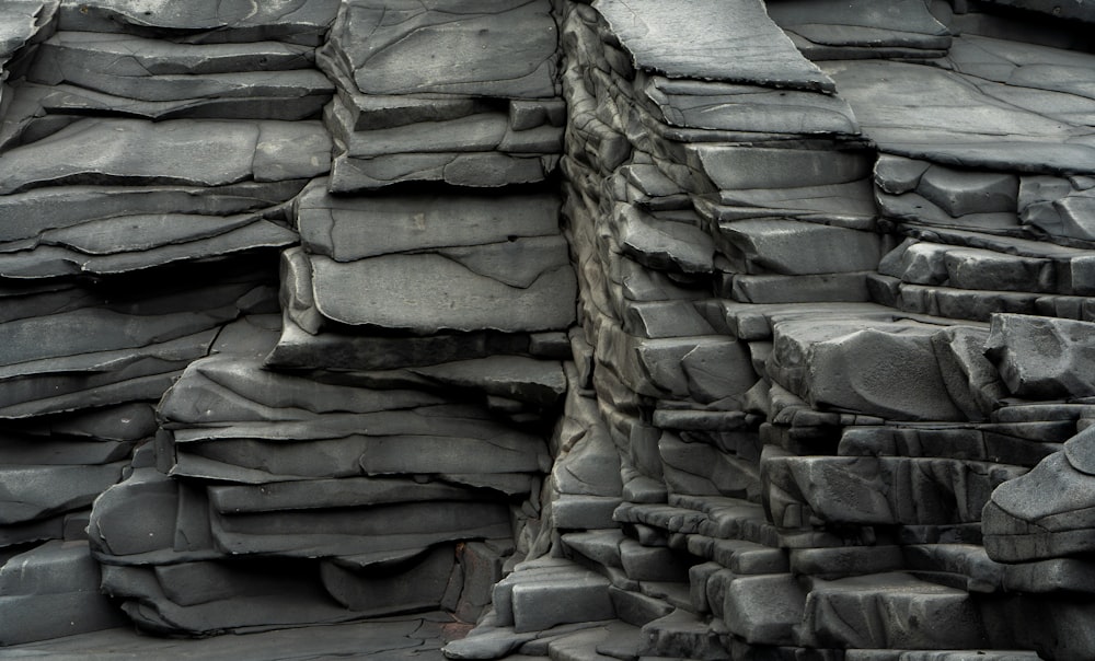 a large rock formation with a bird perched on top of it