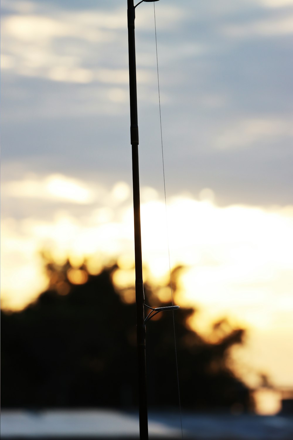 a street light on a pole with a sky in the background