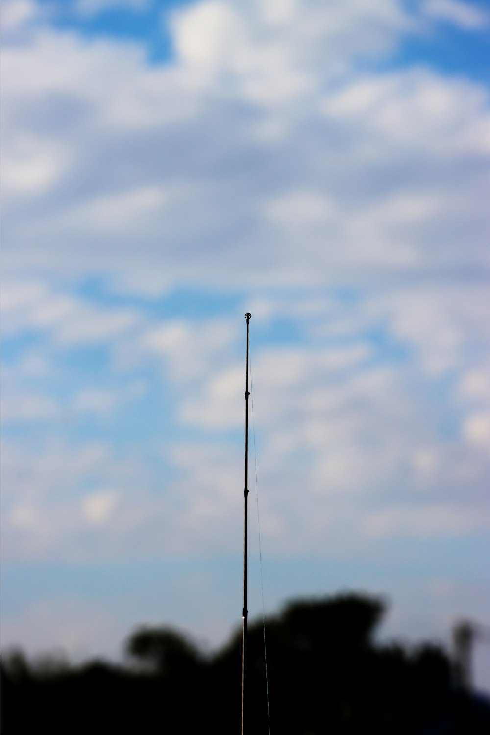 a black and white photo of a cell phone tower