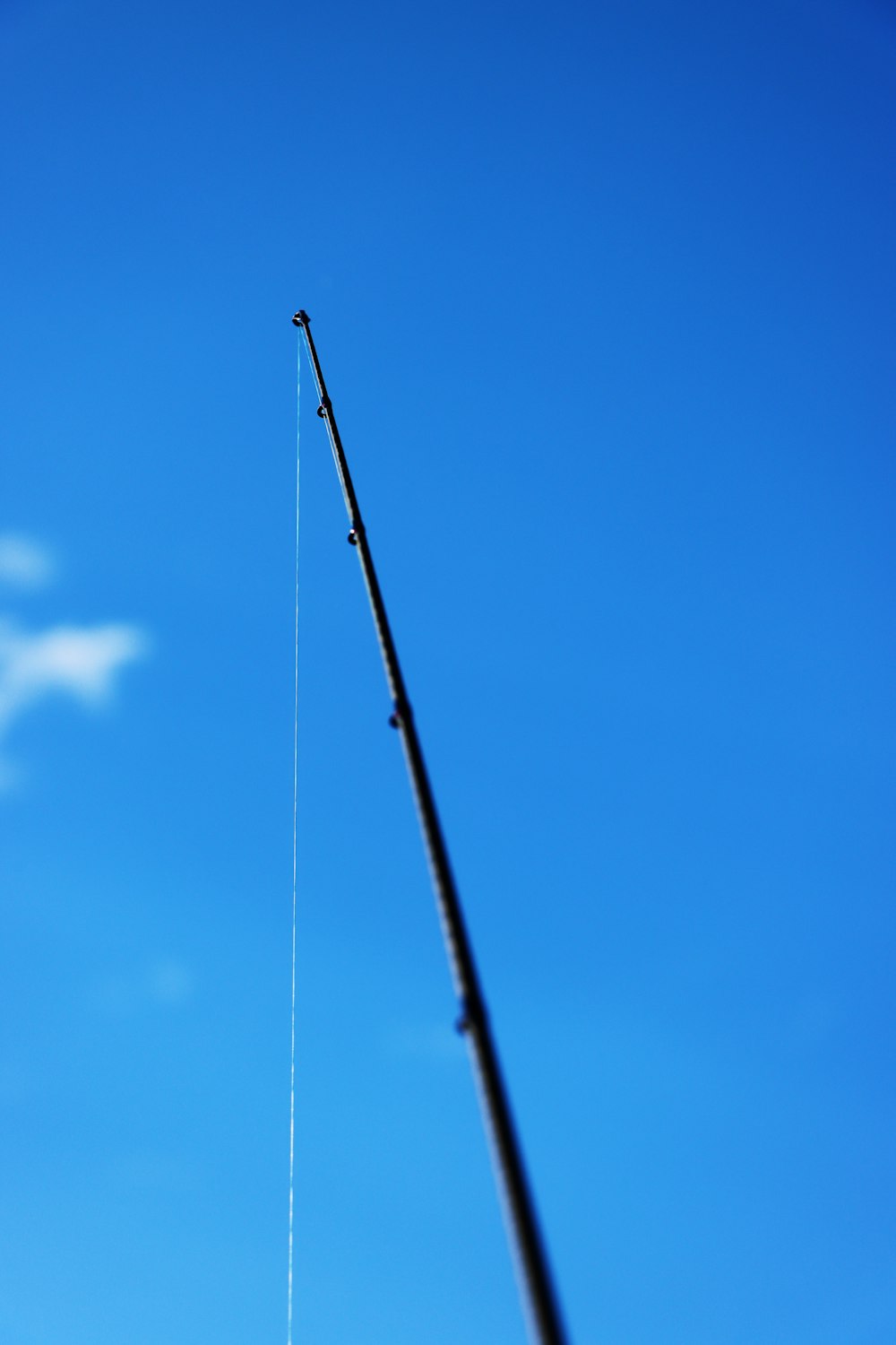 a pole with a fishing rod attached to it
