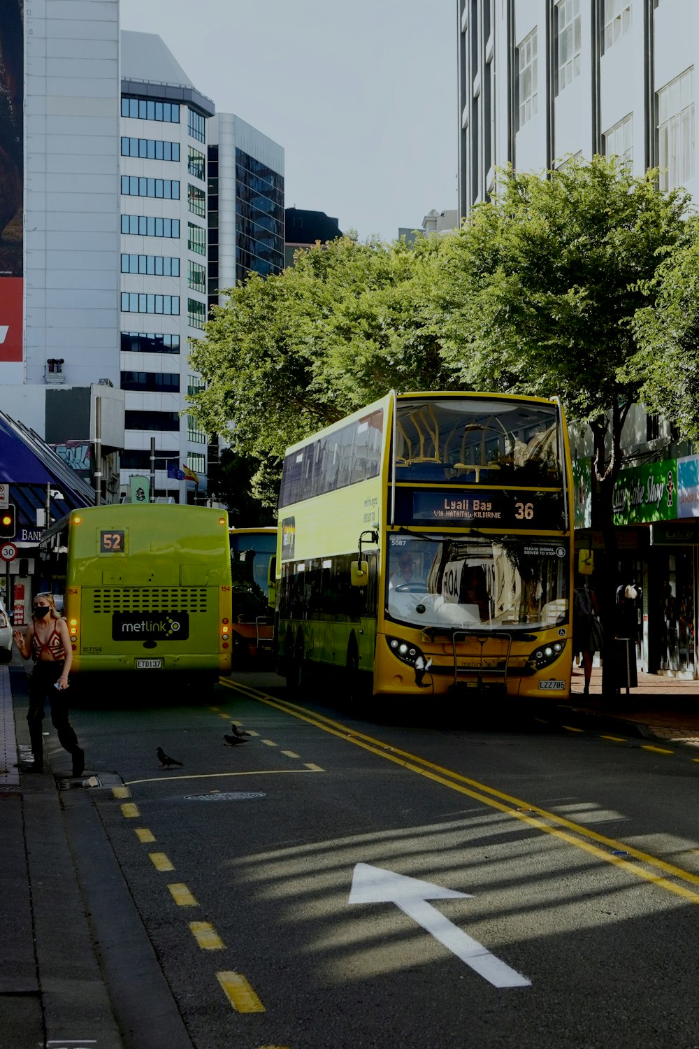 a couple of buses that are sitting in the street