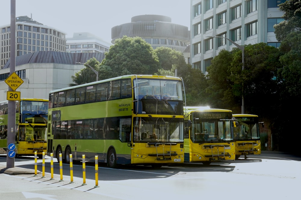 a couple of yellow buses parked next to each other