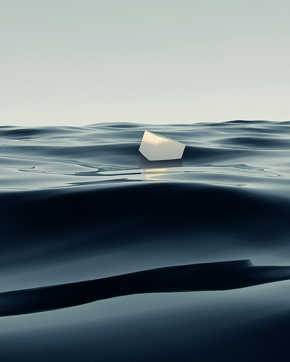 an iceberg floating in the middle of the ocean