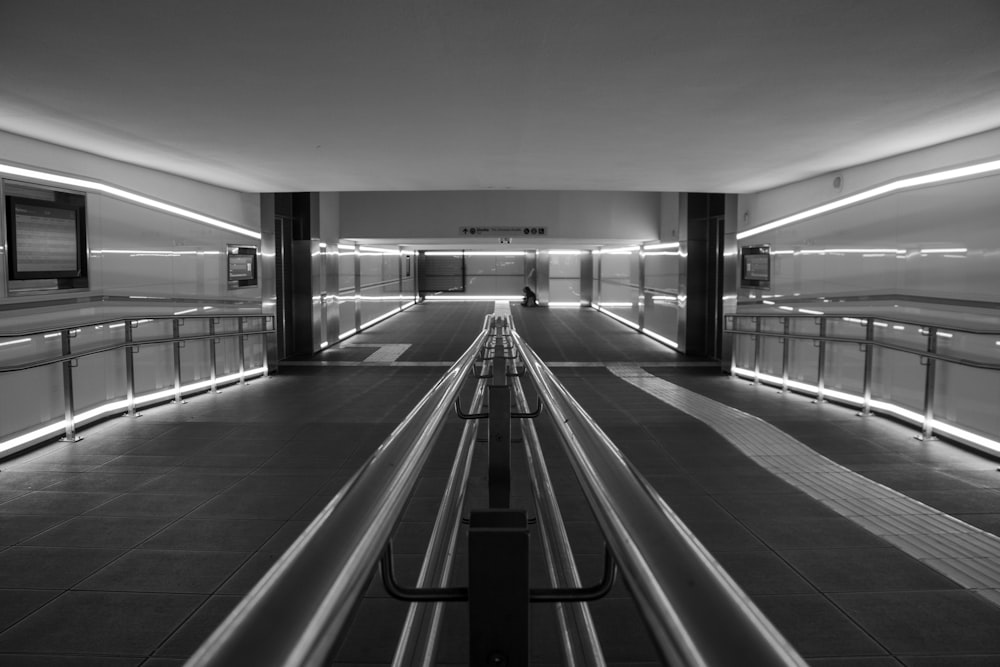 a black and white photo of a subway station