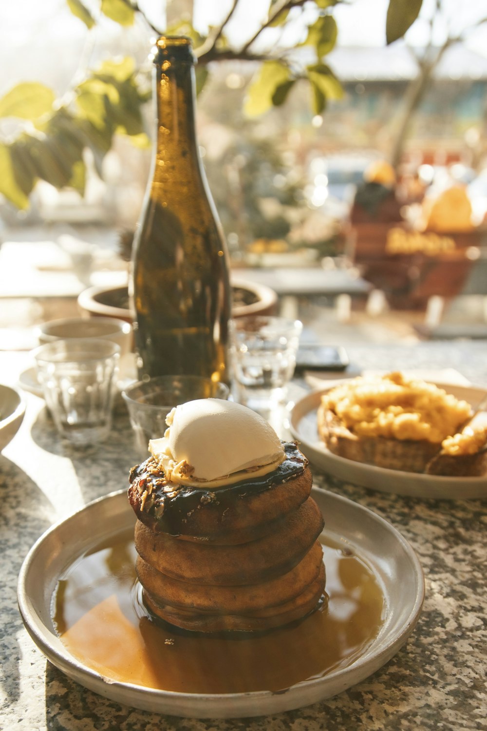 a stack of pancakes sitting on top of a white plate