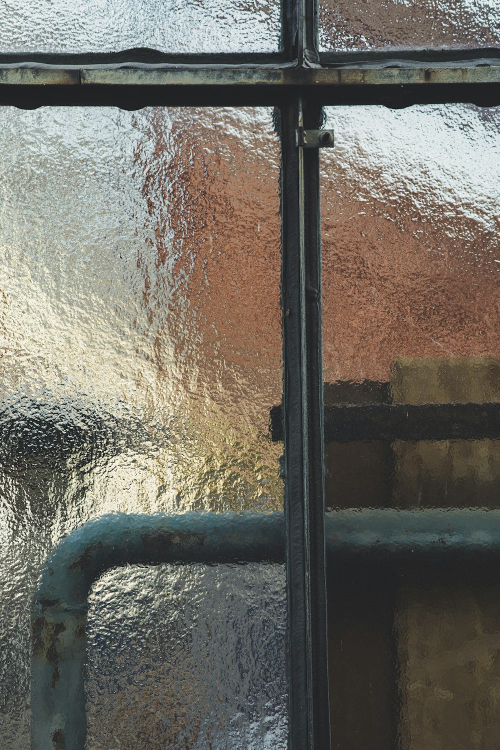 a close up of a window with water on it