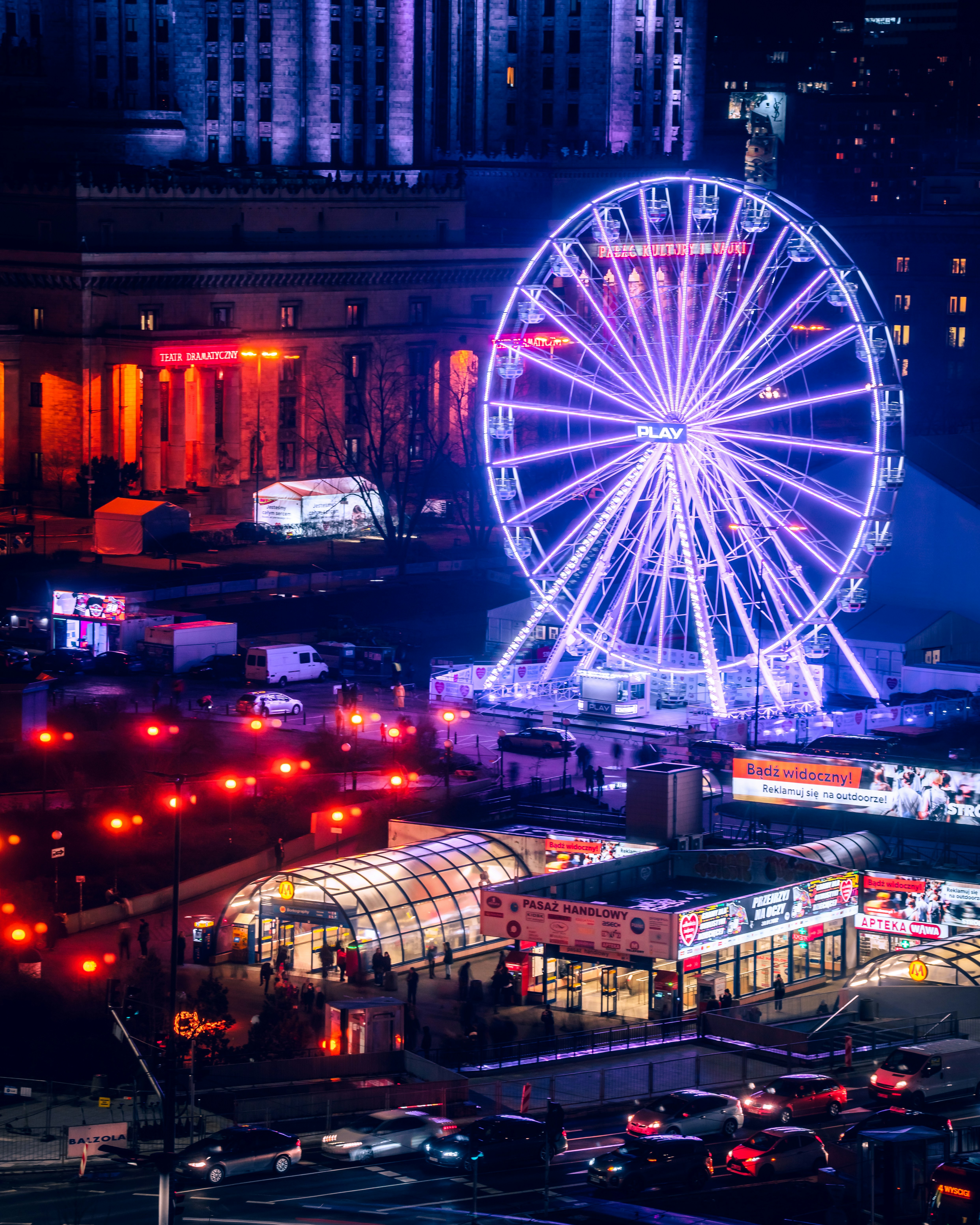 a ferris wheel lit up in the night sky