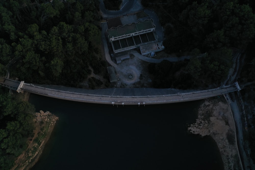 an aerial view of a bridge over a body of water