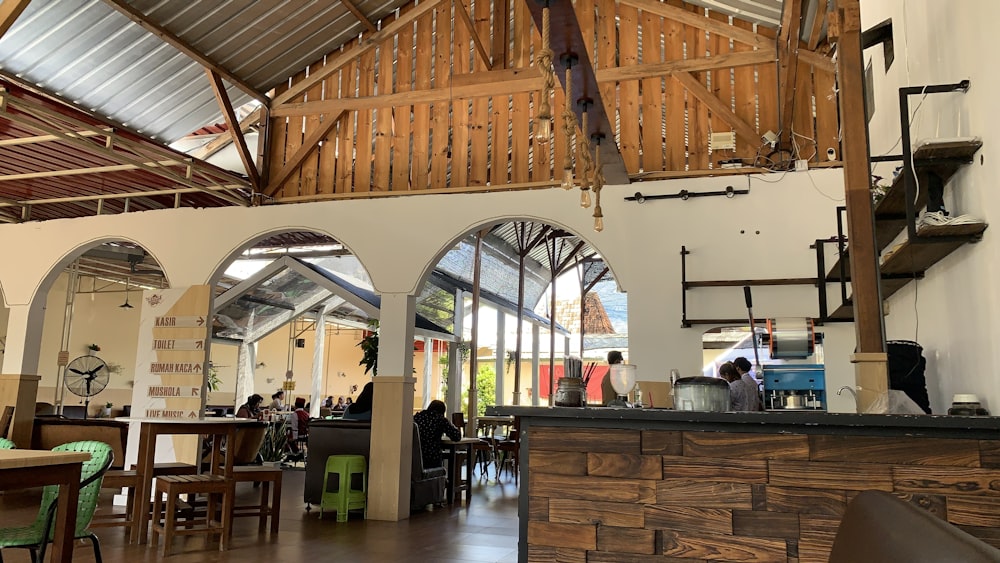 the inside of a restaurant with tables and chairs