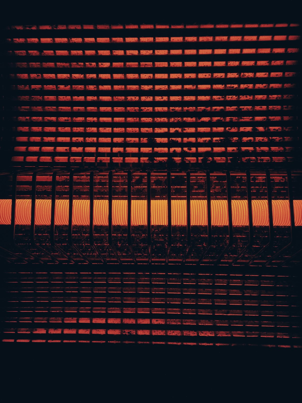 Close up of a heater glowing red and orange