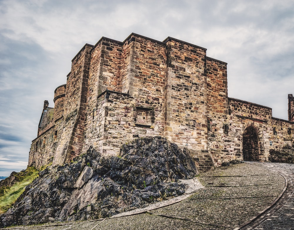 a stone castle sitting on top of a hill