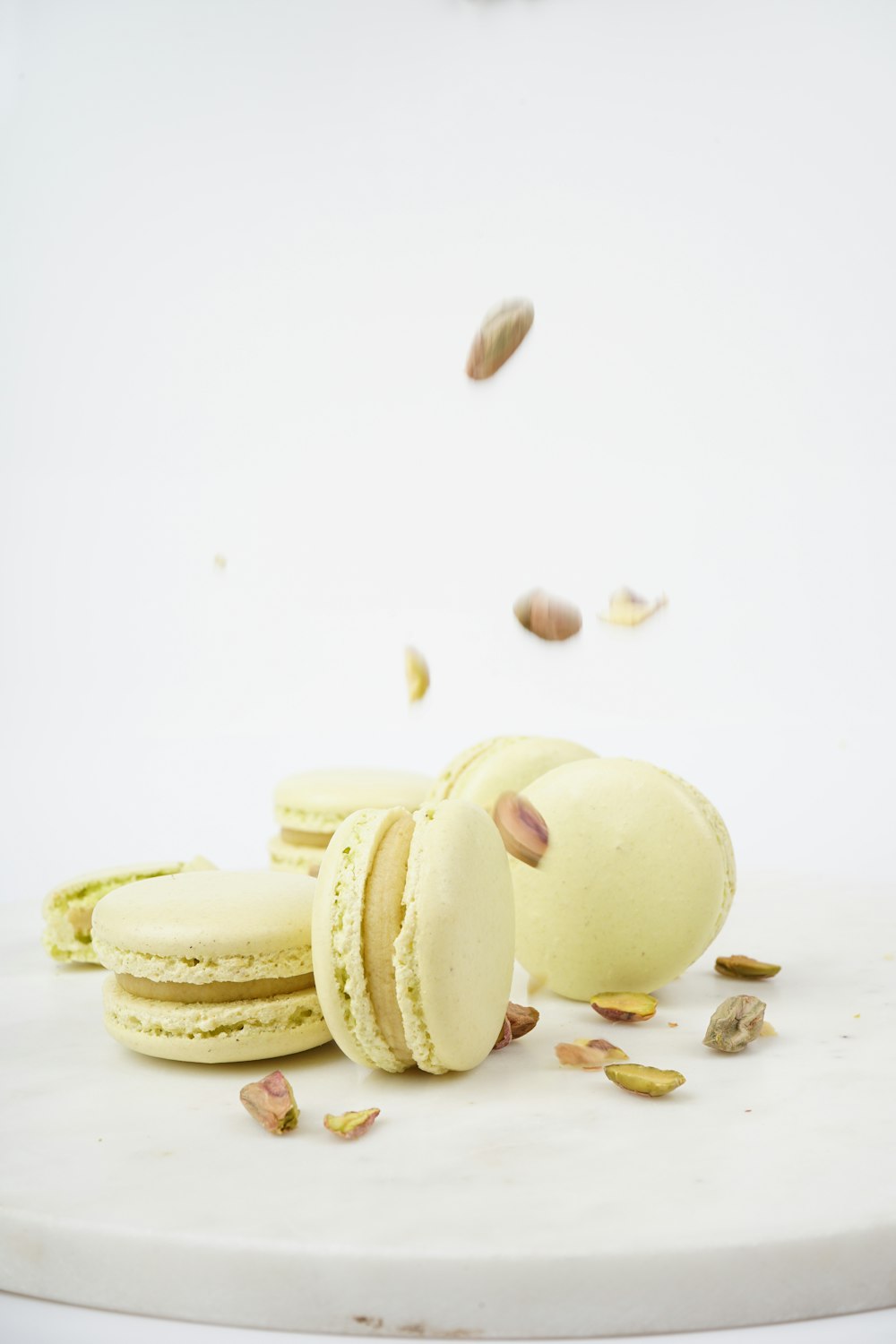 a pile of macaroons sitting on top of a white table