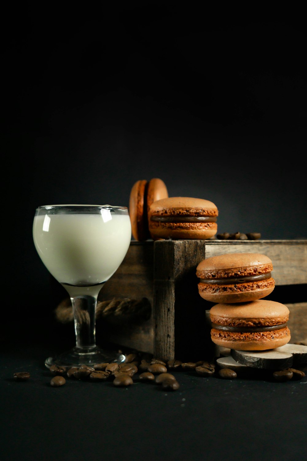 a glass of milk and some cookies on a table