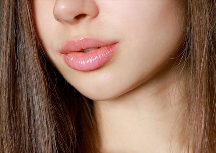 a close up of a woman with long brown hair