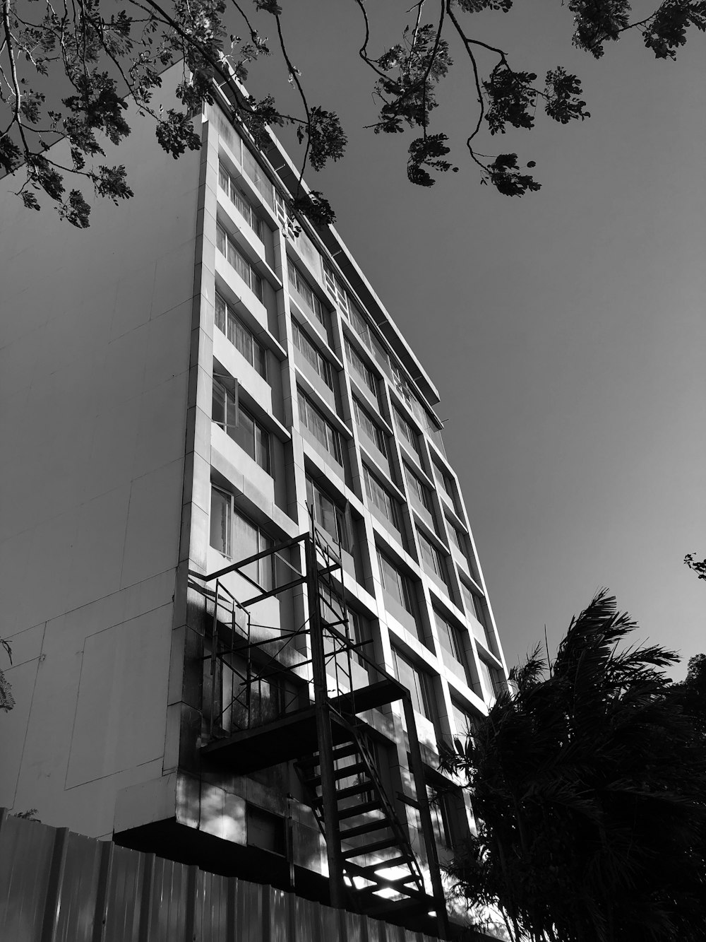 a black and white photo of a tall building