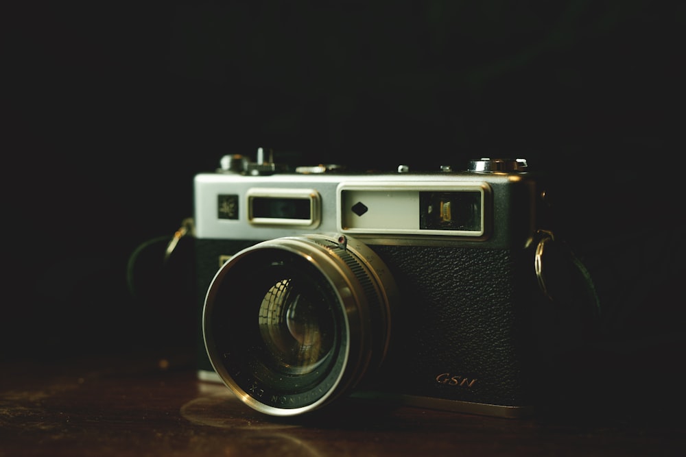 a camera sitting on top of a wooden table