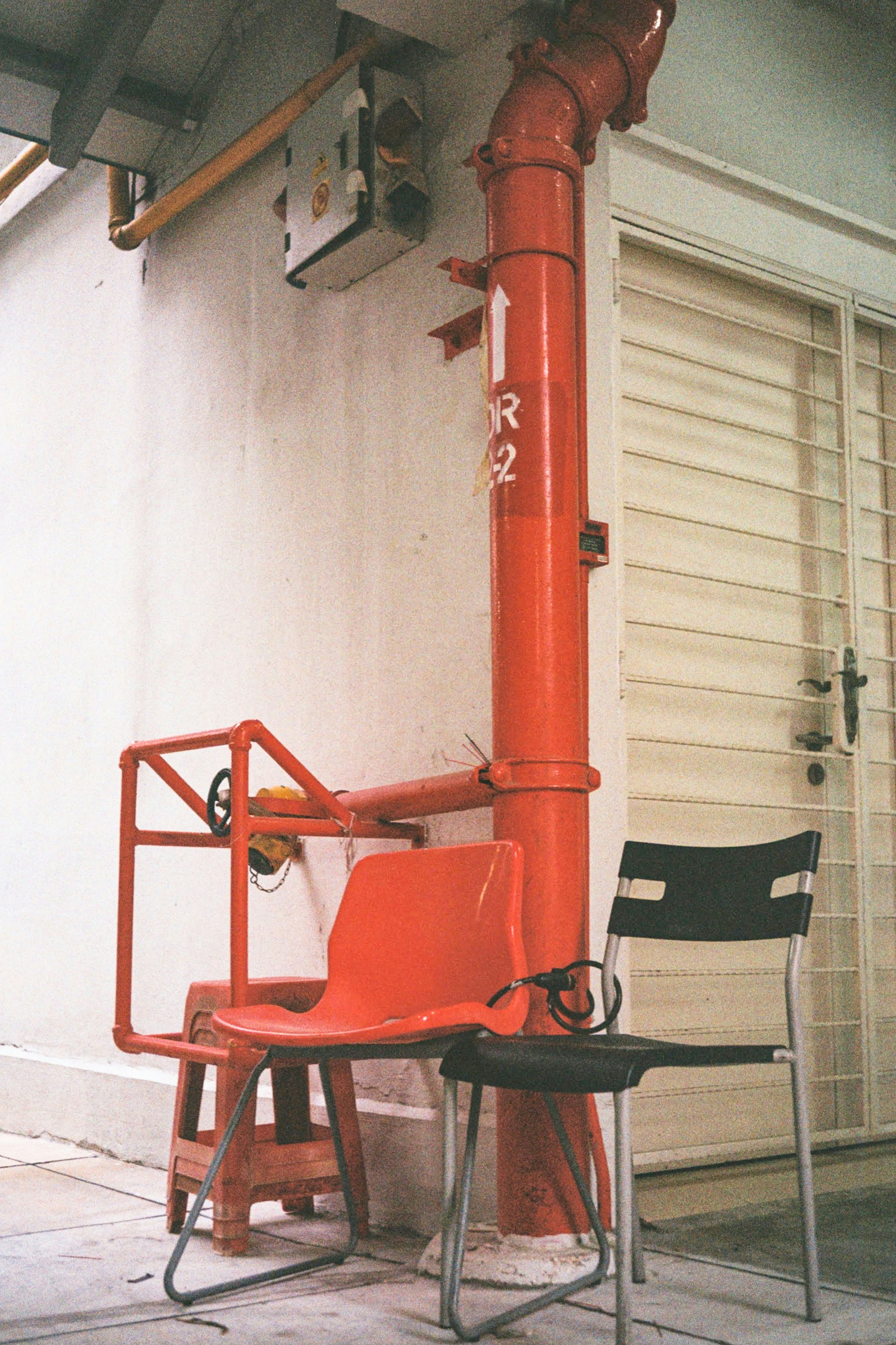 a chair sitting in front of a building