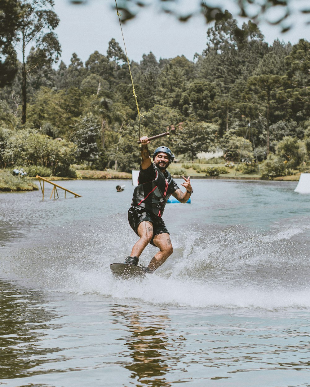 a man water skiing on a lake