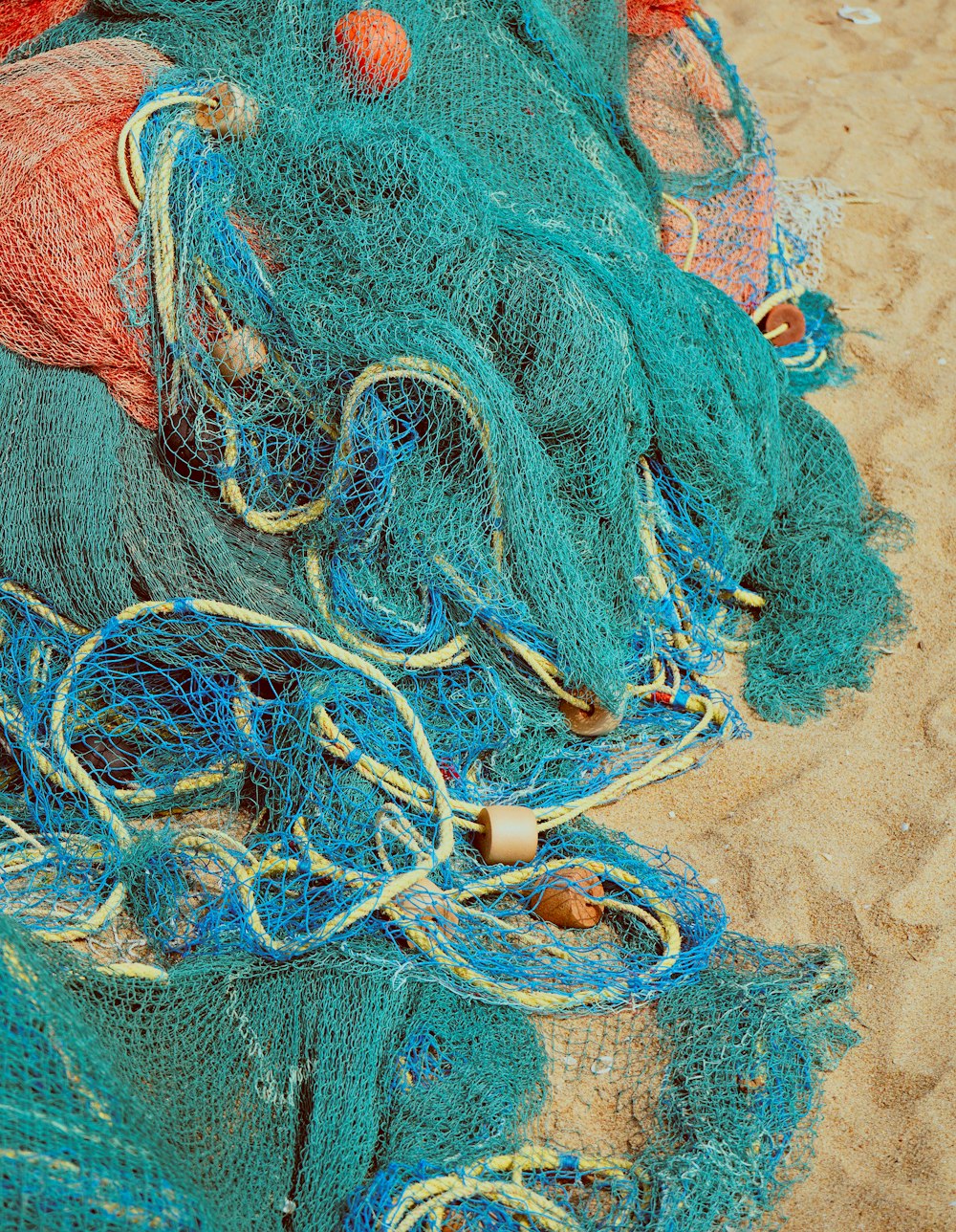 a pile of blue and red fishing nets
