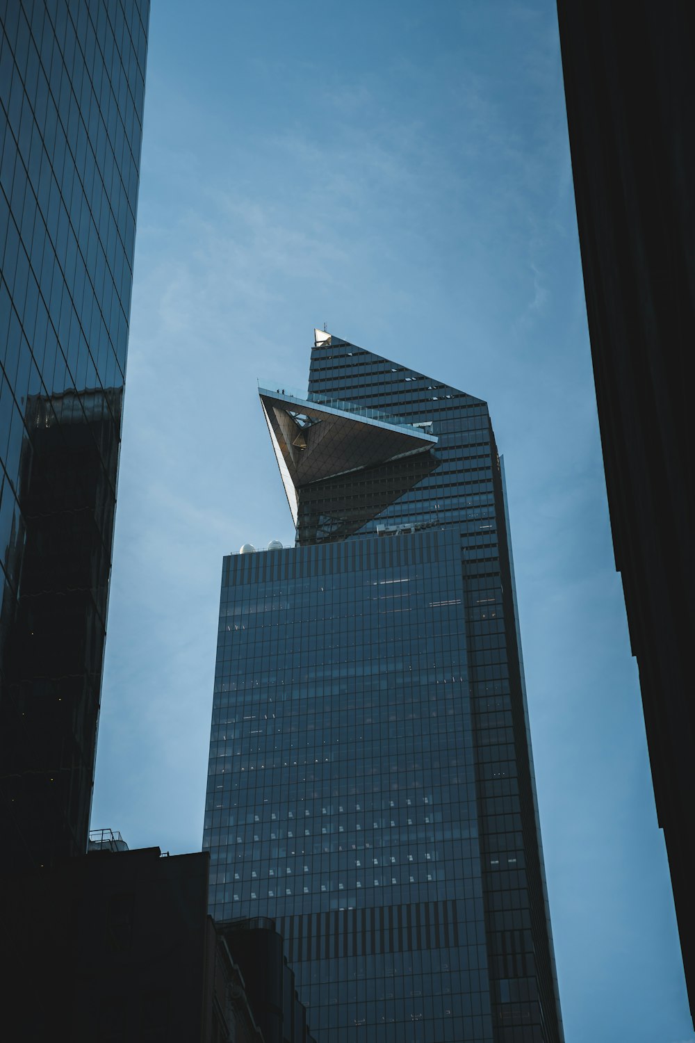 a very tall building with a triangular roof