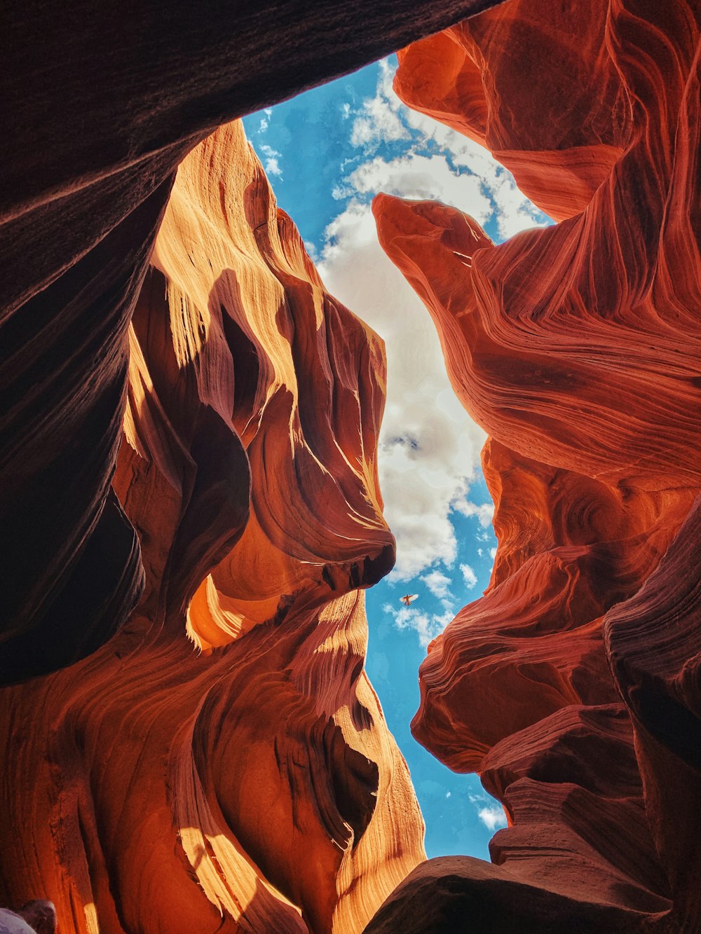 a view of the sky through a slot in a canyon