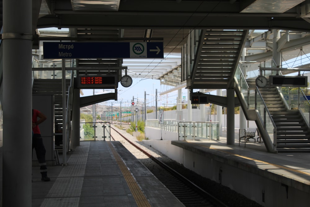 a train station with a train on the tracks