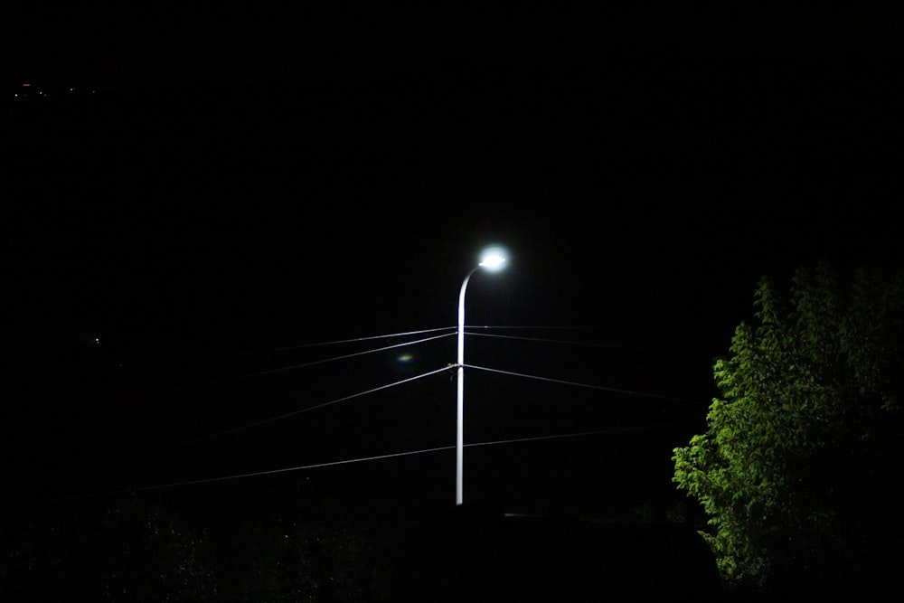 a street light is lit up at night