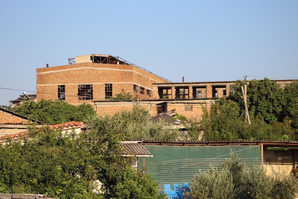 a building with a lot of trees in front of it