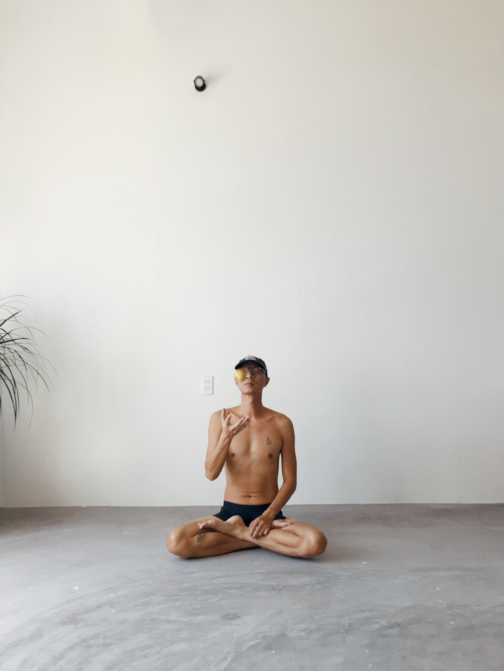 a man sitting on the floor in a room