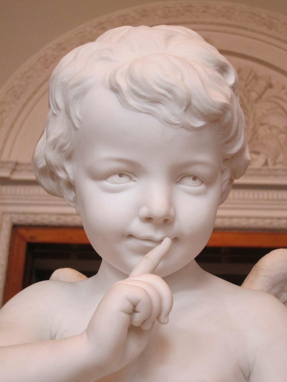 a close up of a statue of a child