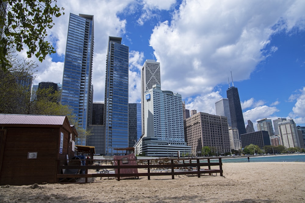 a beach area with buildings in the background